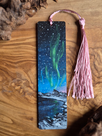 Hand-painted wooden bookmark of the northern lights in the evening