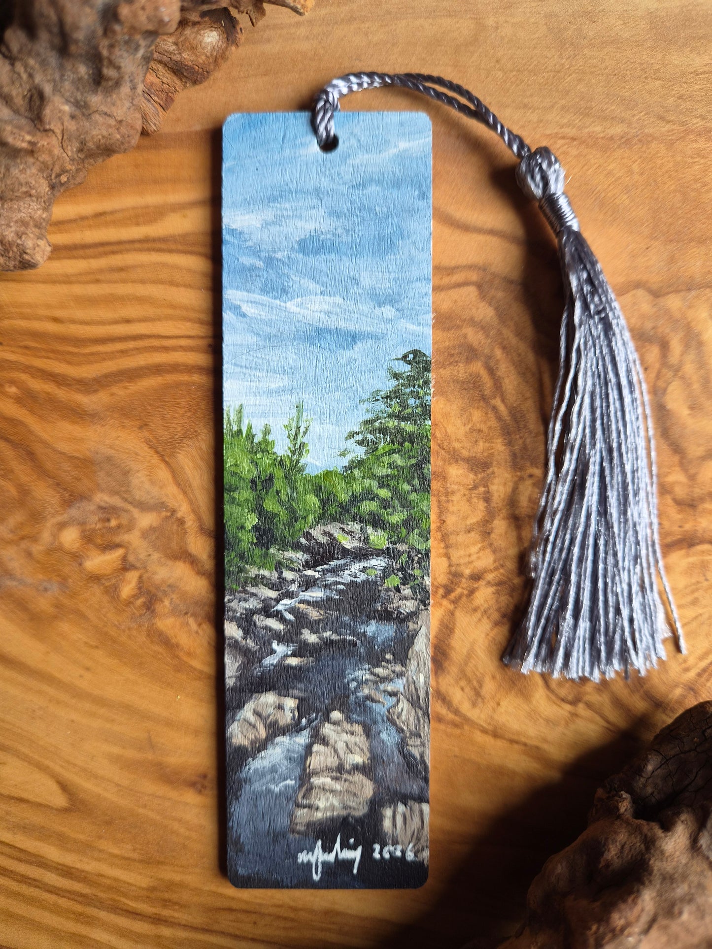 Hand-painted wooden bookmark of the river findhorn at Randolphs leap with dark powerful water and rock formations