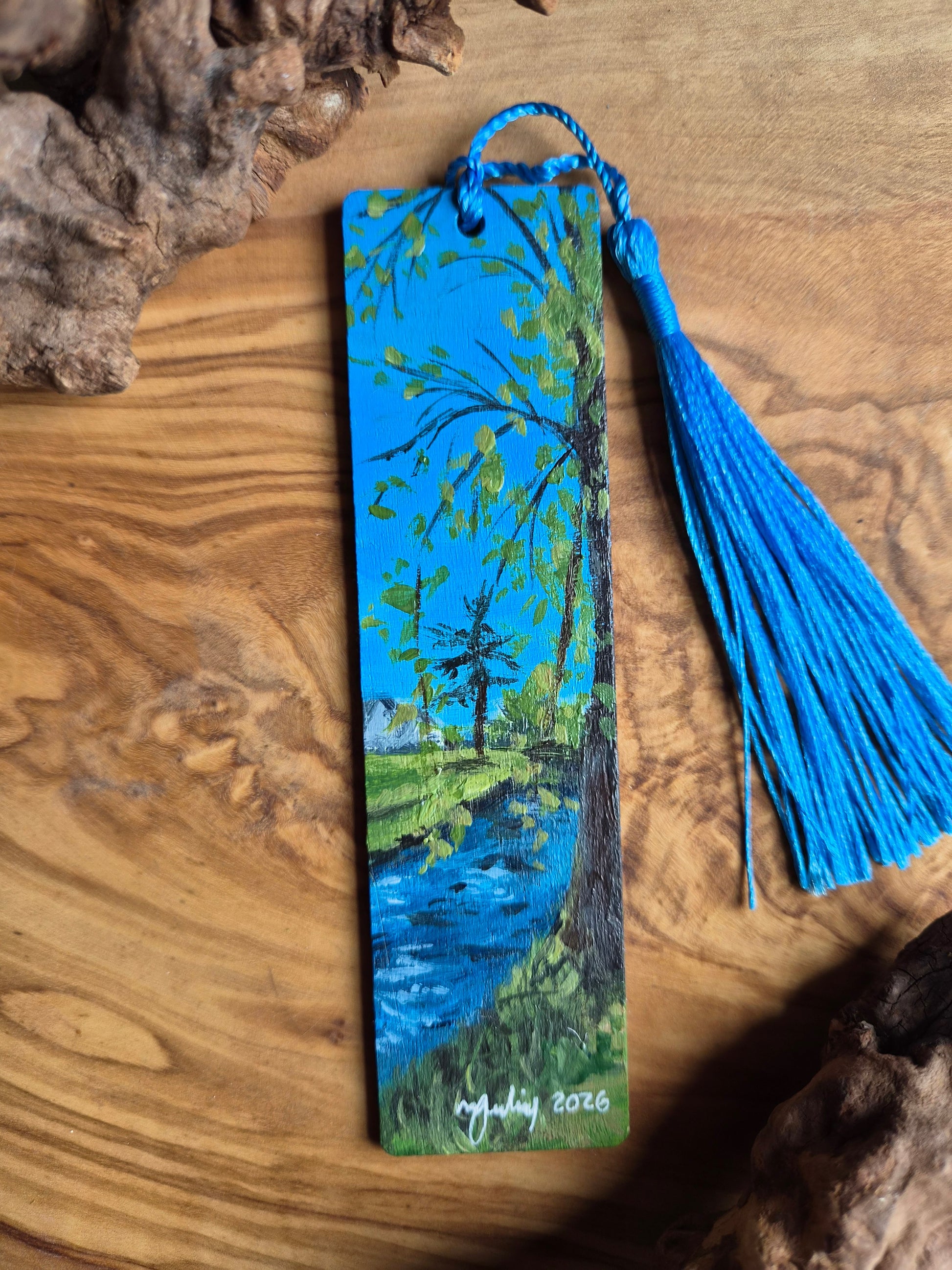 Hand-painted wooden bookmark of the burn by the War Memorial, Forres