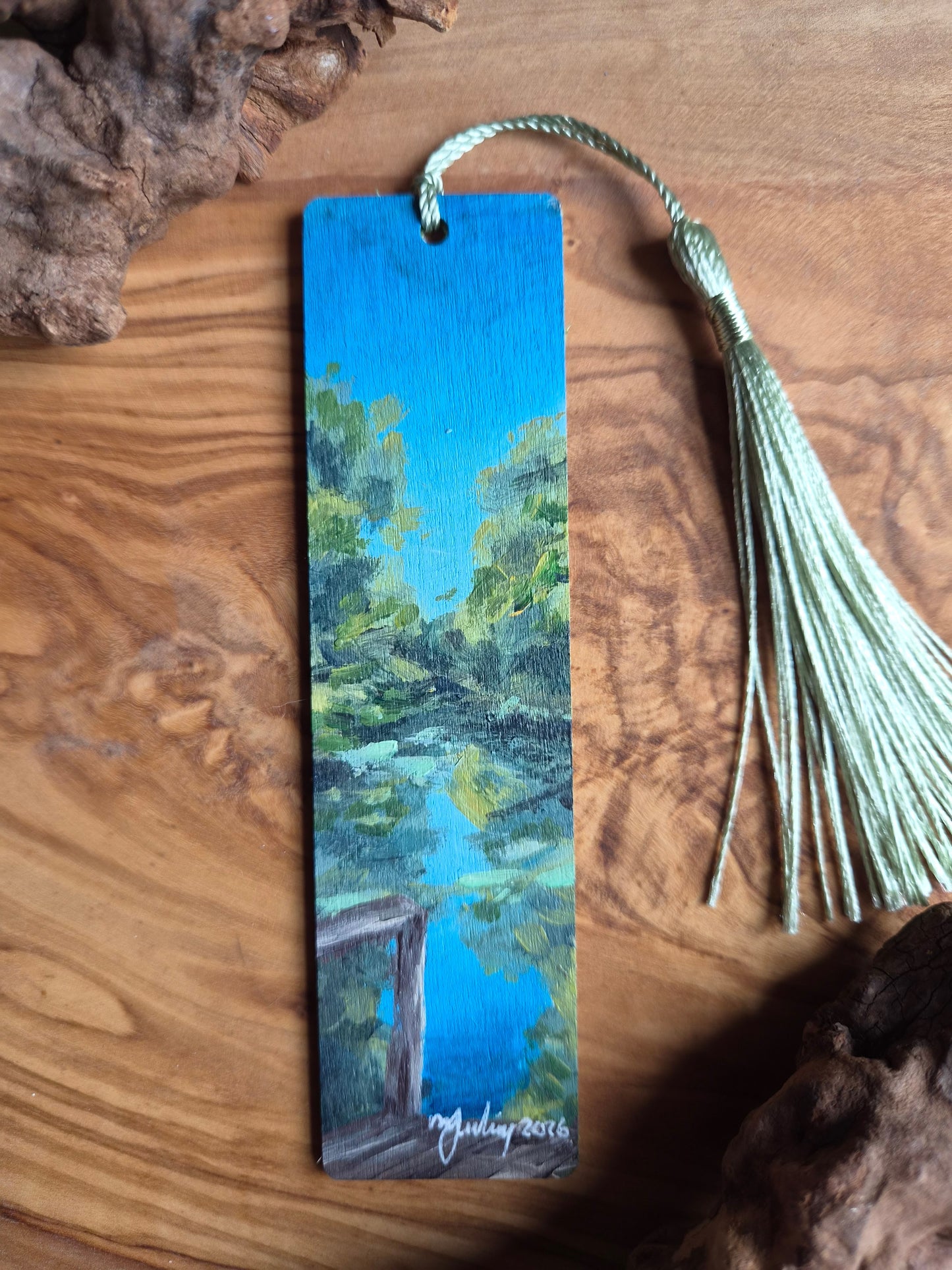 Hand-painted wooden bookmark of the natural rock springs at Kelly Park, Florida