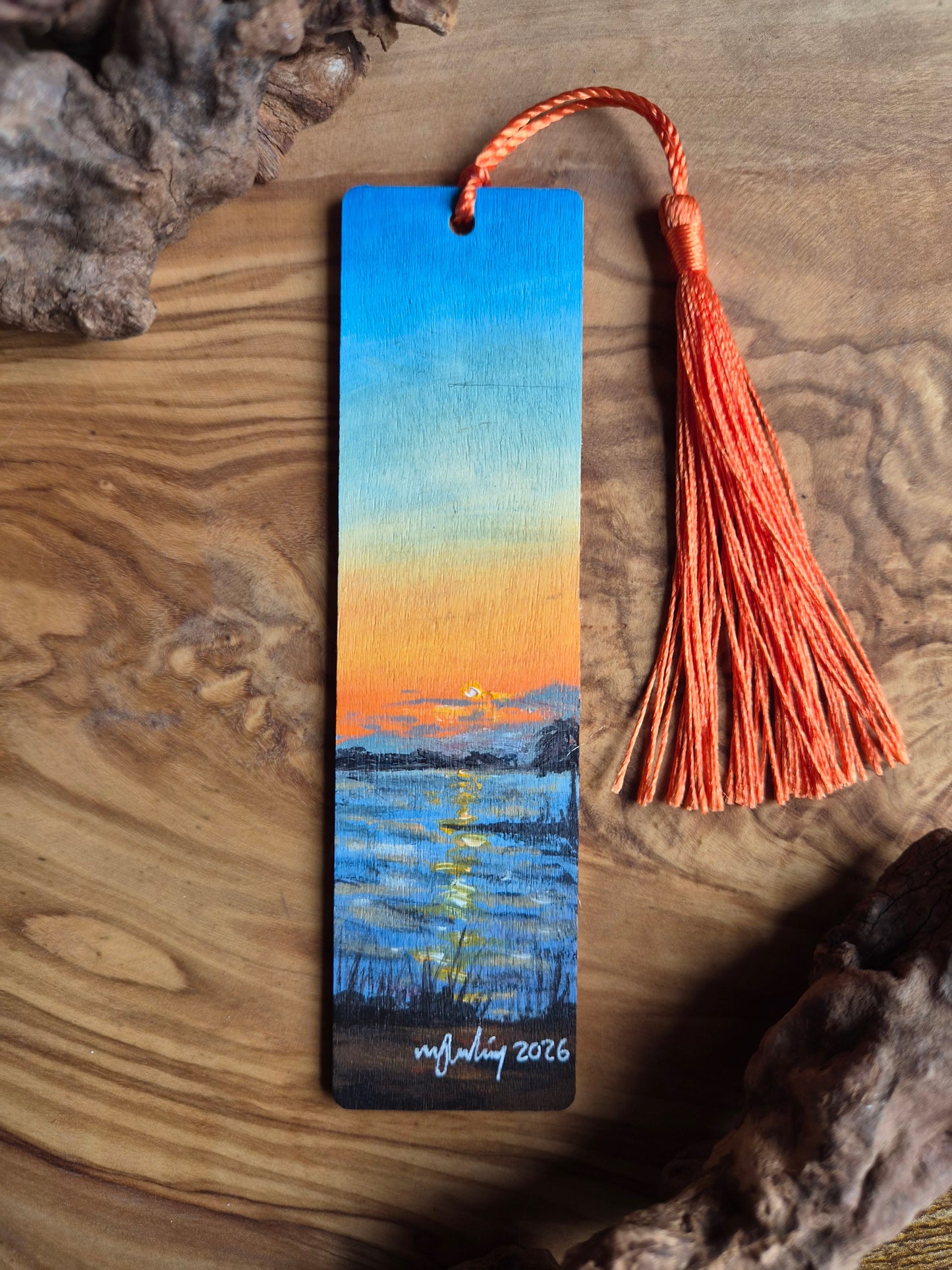 Hand-painted wooden bookmark of a sunset on Lake Dora in Mount Dora, Florida