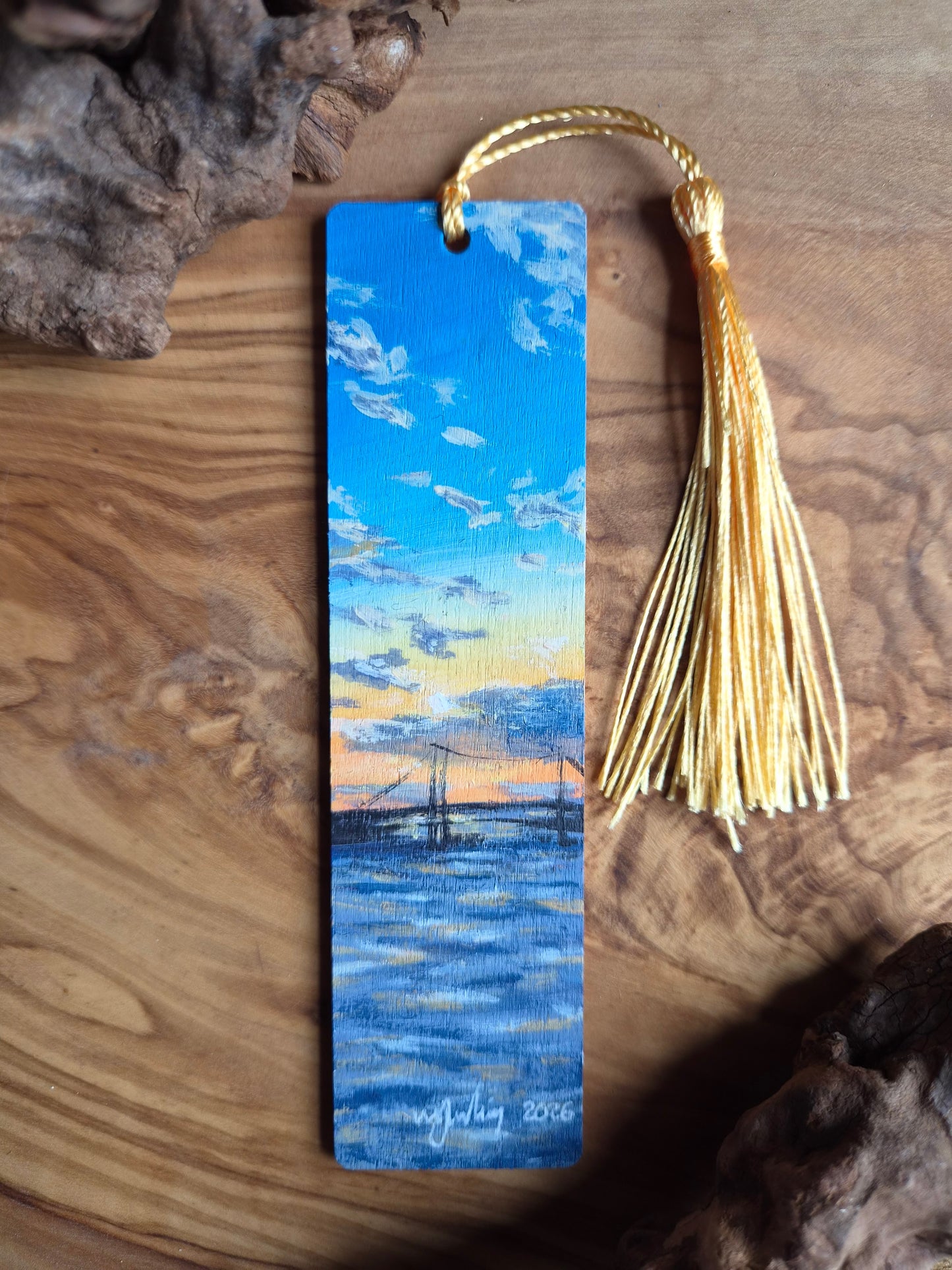 Hand-painted wooden bookmark of the iconic Forth Road Bridge with a Sunset behind