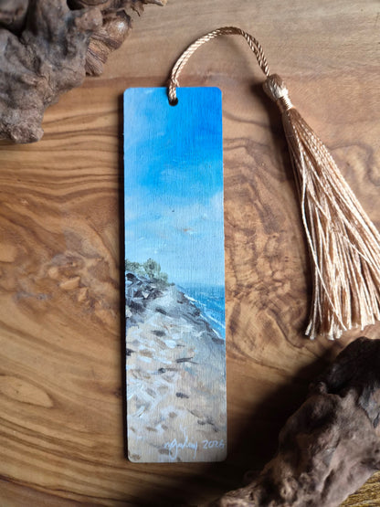 Hand-painted wooden bookmark of Nairn Beach with a har rolling in