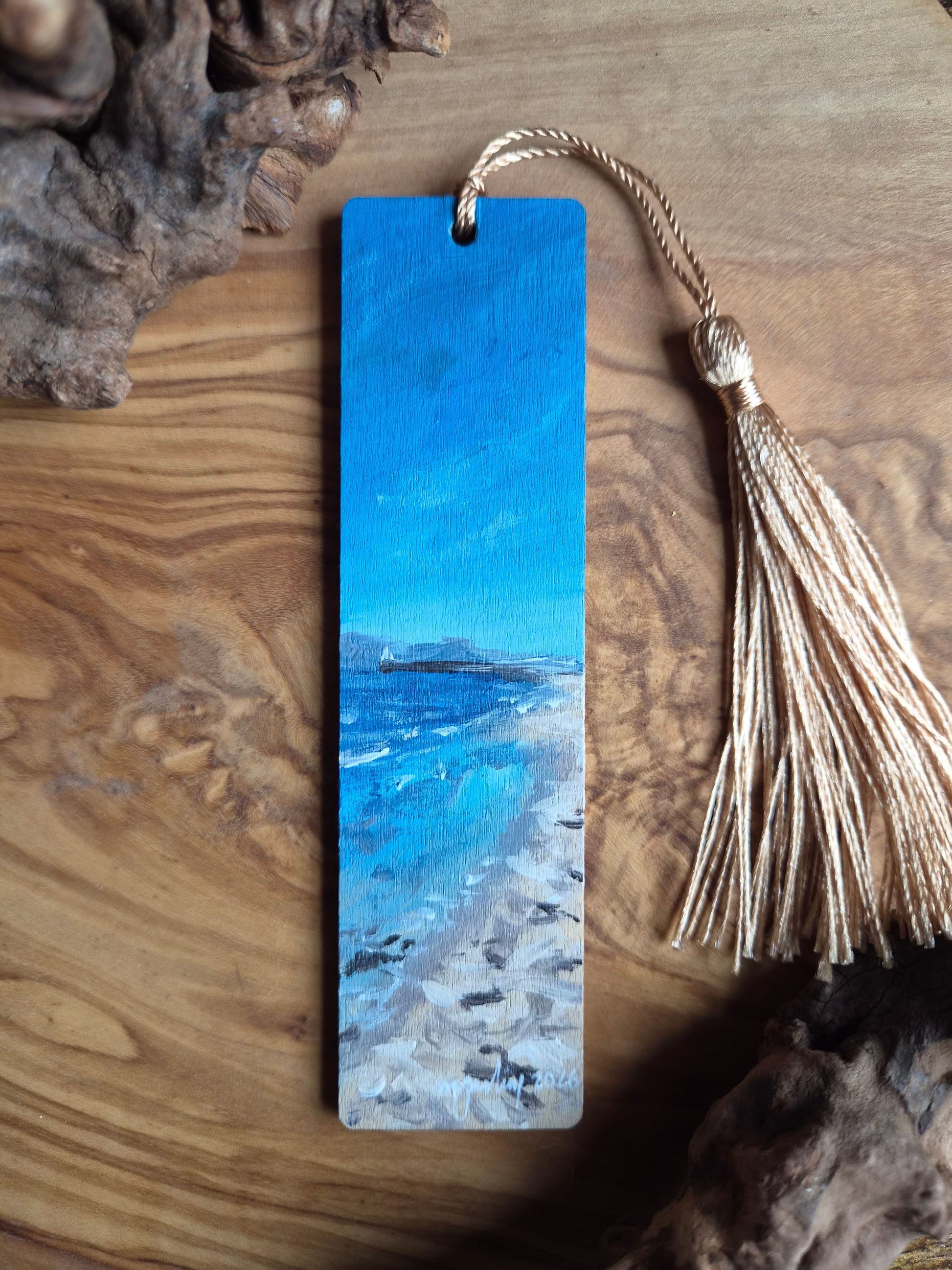 Hand-painted wooden bookmark of Nairn beach and blue skies