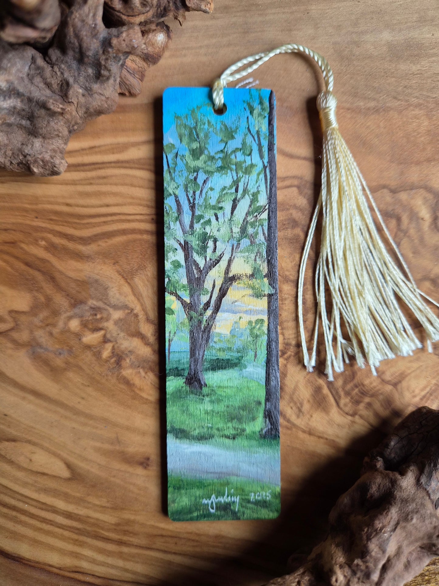 Hand-painted wooden bookmark of a sunset at Grant Park in Forres through the trees