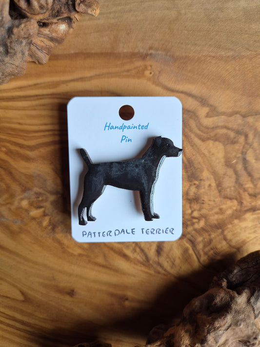 Hand-painted black patterdale terrier shaped dog pin badge, painted onto wood.