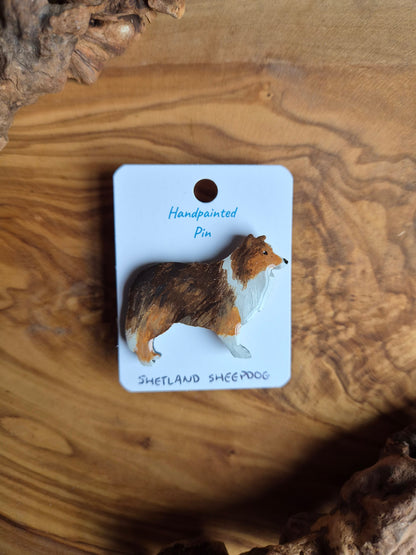 Hand-painted, dark sable coloured Shetland Sheepdog dog pin badge painted on wood