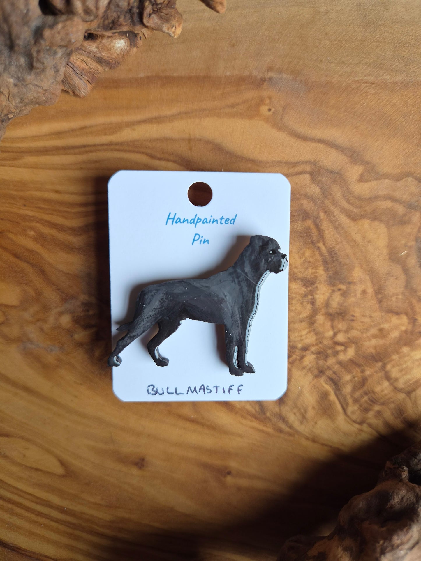Hand-painted, blackcoloured Mastiff dog pin badge painted on wood