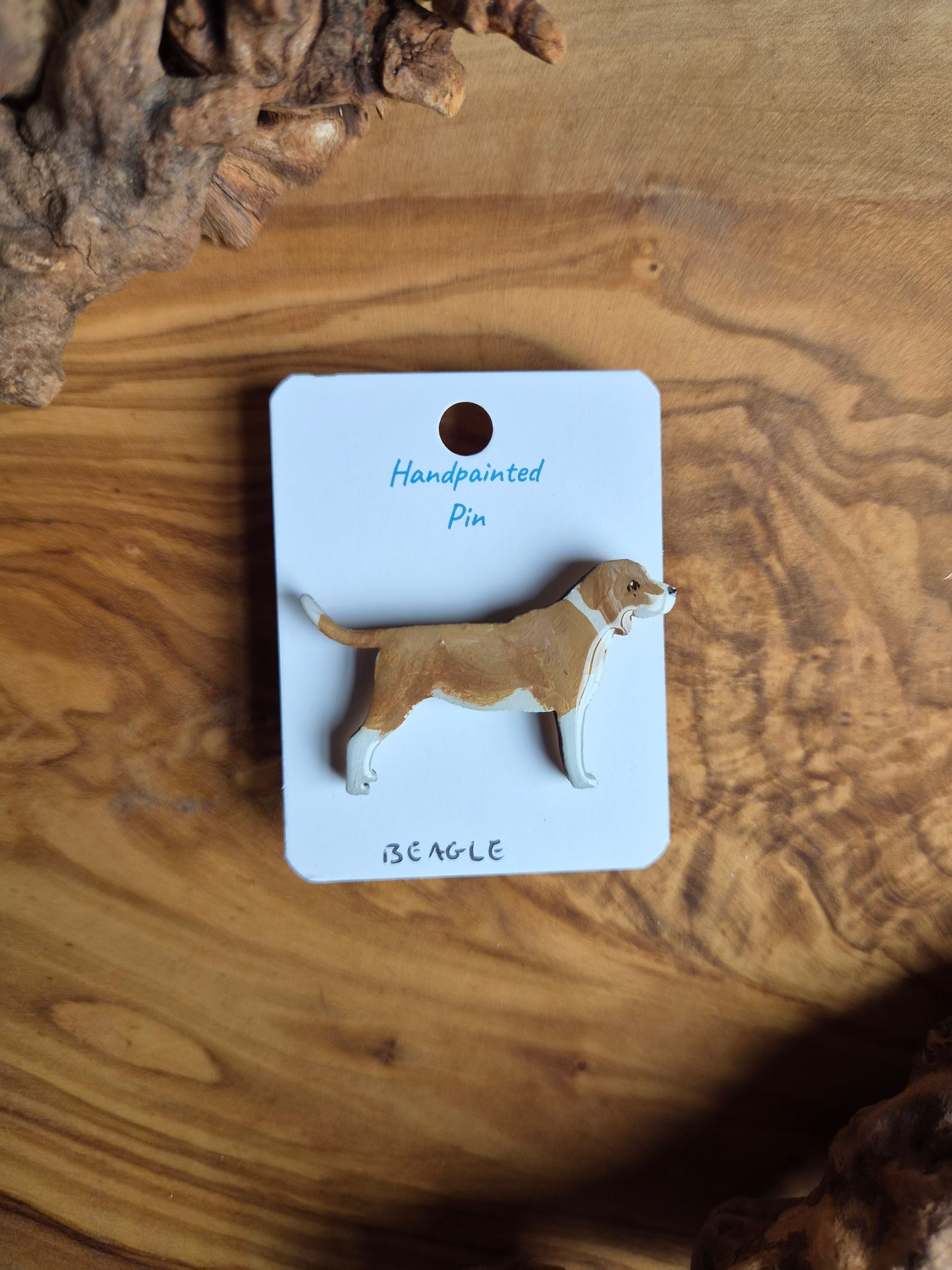 Hand-painted, red and white coloured Beagle dog pin badge painted on wood