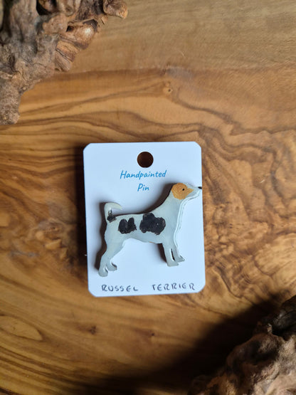 tricoloured, hand-painted wooden pin badge of a Russel Terrier dog
