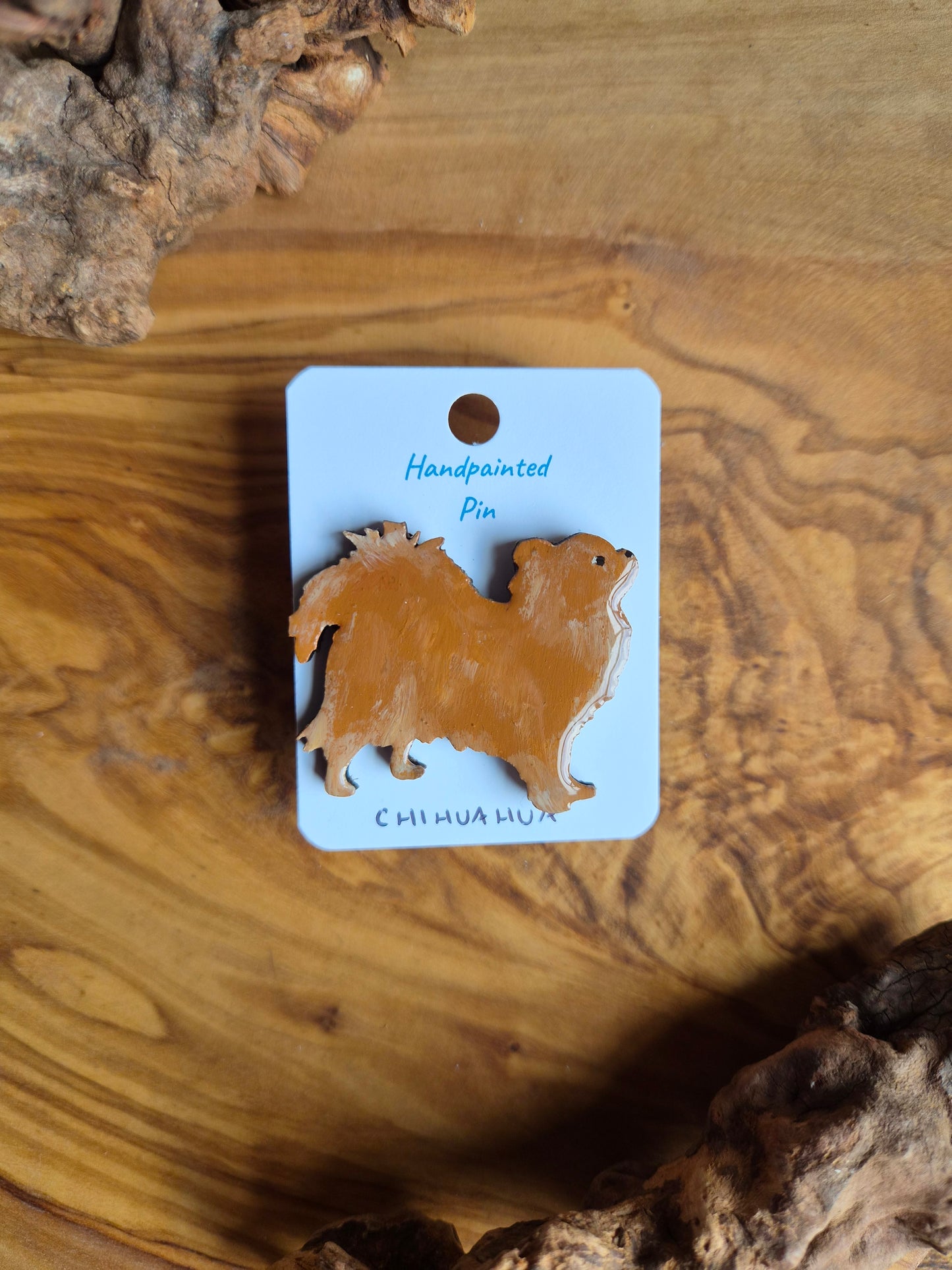 Hand-painted wooden dog pin badge of a longhaired red chihuahua