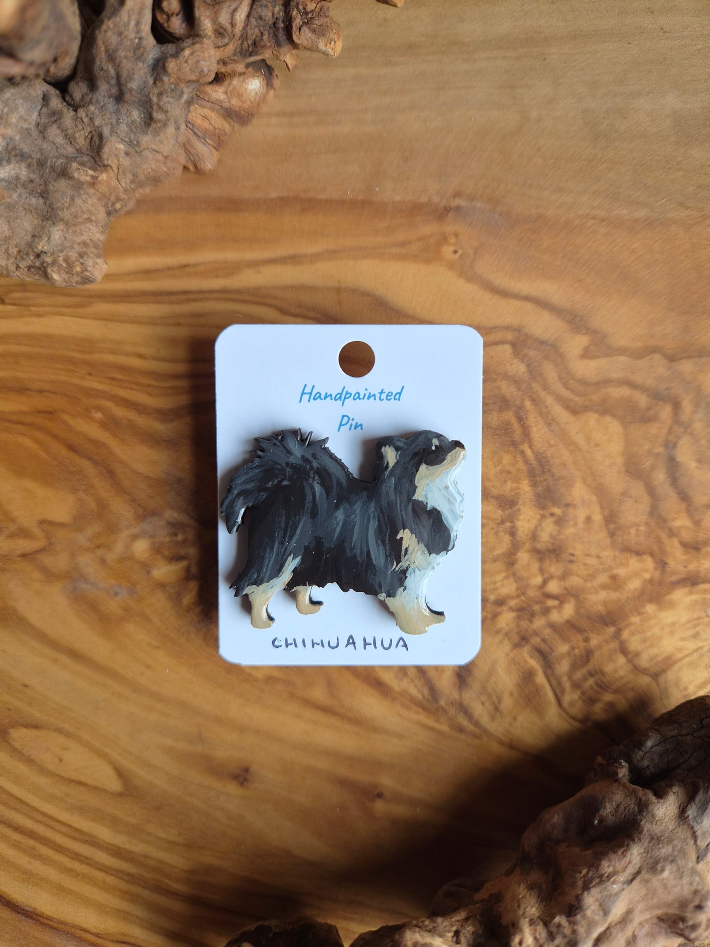 Hand-painted wooden dog pin badge of a longhaired tri coloured chihuahua