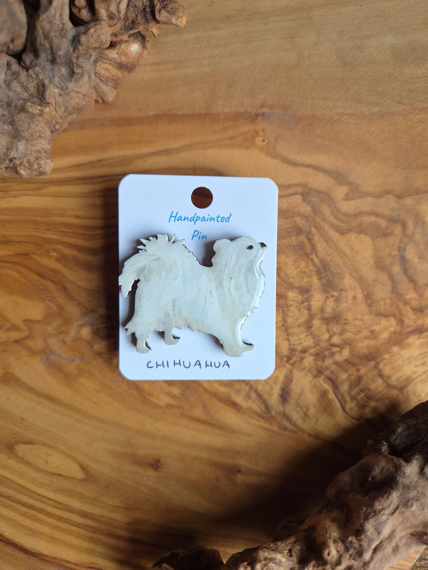 Hand-painted wooden dog pin badge of a longhaired white chihuahua