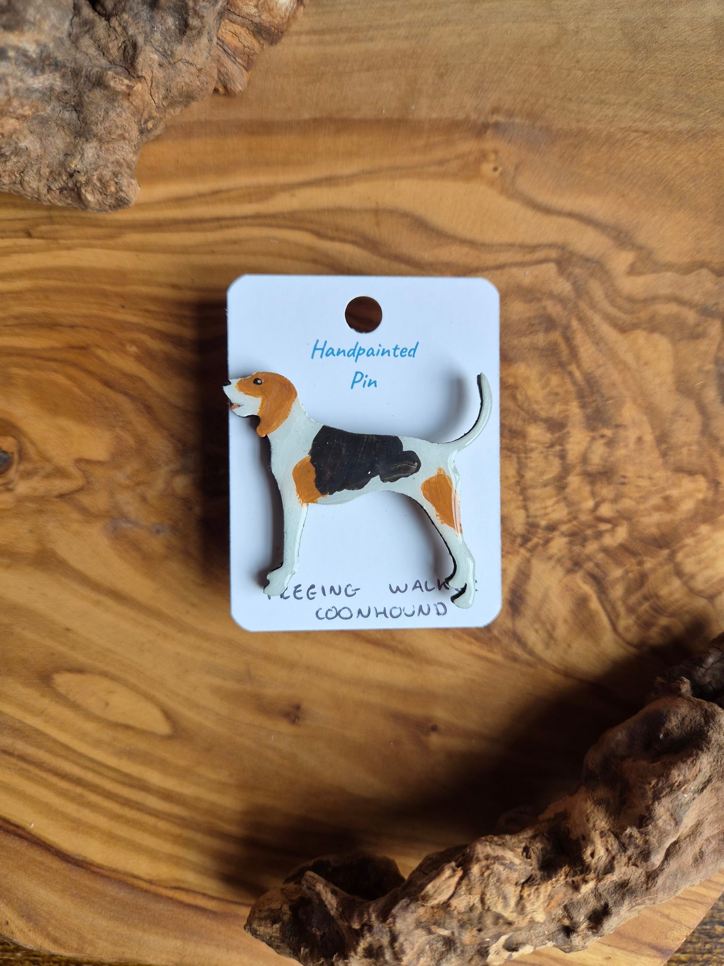 Hand-painted wooden dog shaped pin badge of a tri coloured Treeing Walker coonhound