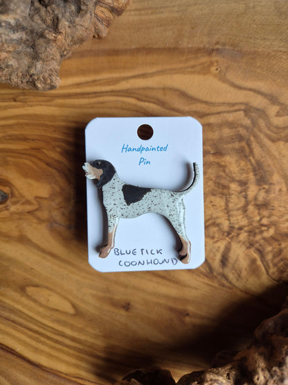 Hand-painted wooden dog shaped pin badge of a bluetick coonhound