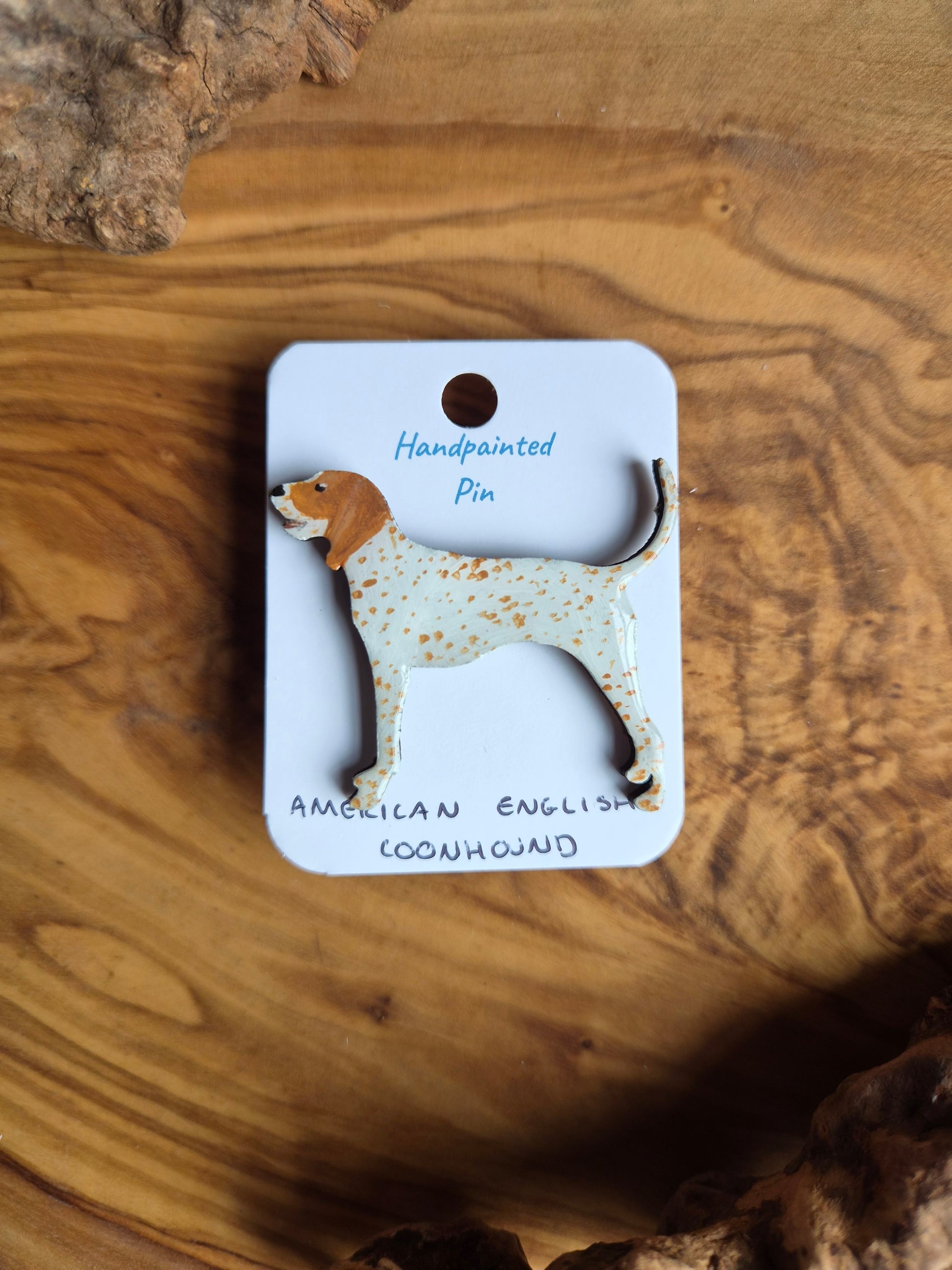 Hand-painted wooden dog shaped pin badge of an American English coonhound