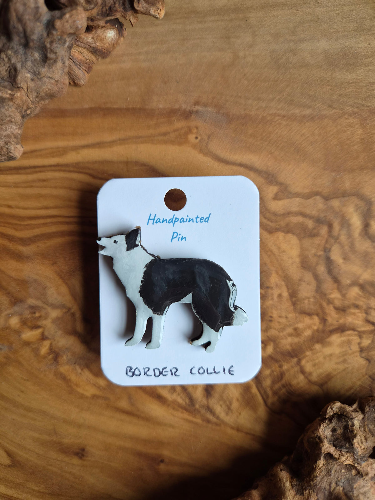 Hand-painted dog shaped wooden pin badge of the border collie. Black and white with a black ear patch and white face
