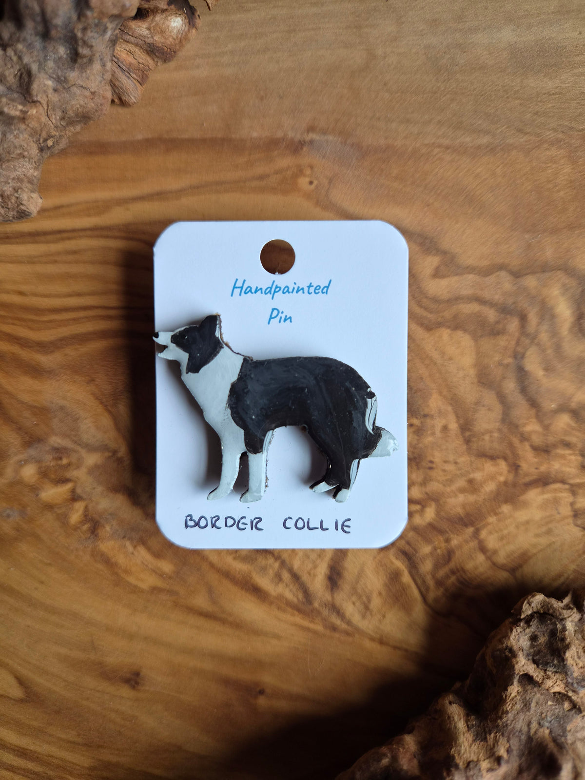 Hand-painted dog shaped wooden pin badge of the border collie. Black and white 