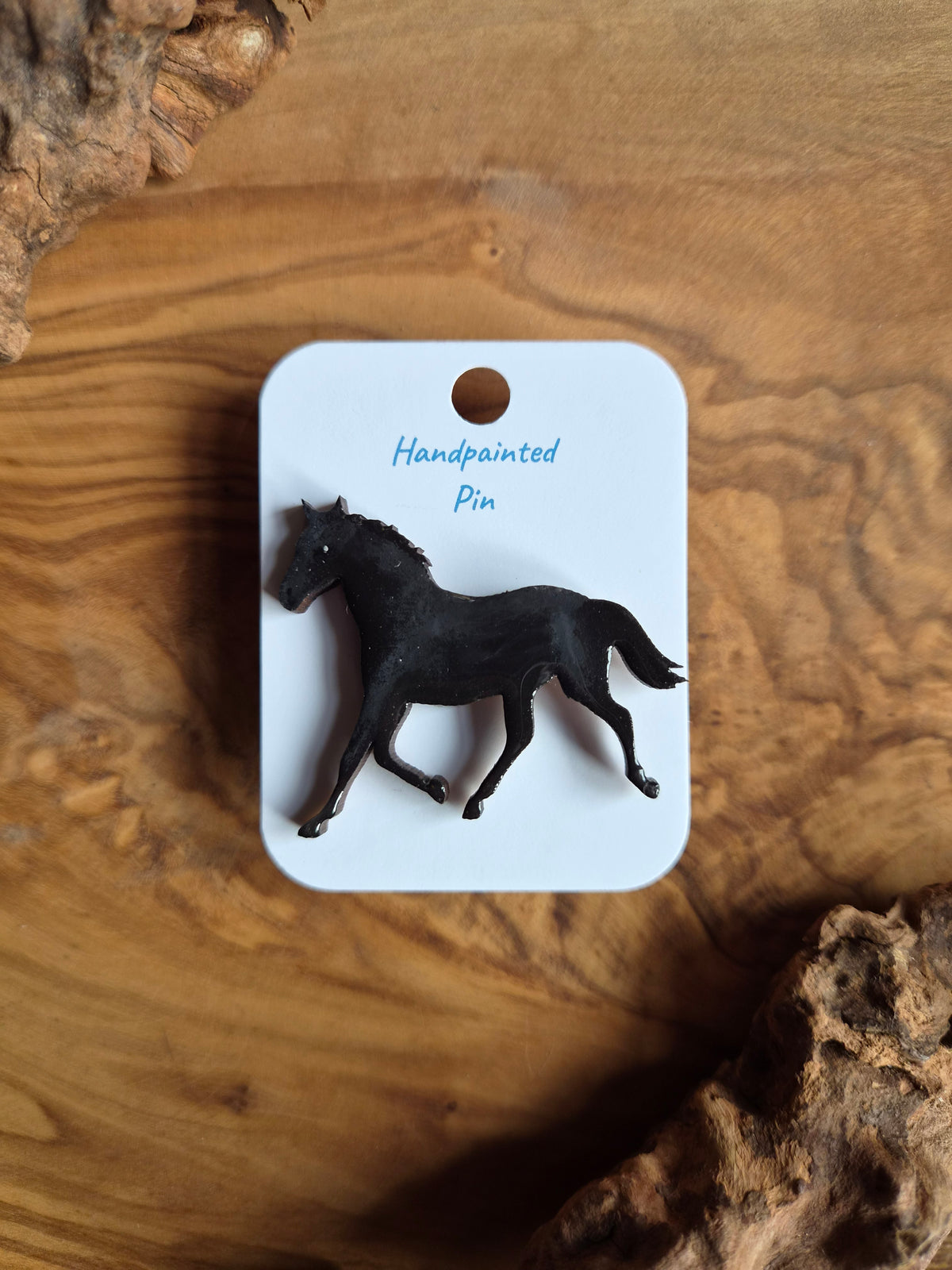 Hand-painted horse shaped wooden pin badge.  solid black coloured horse