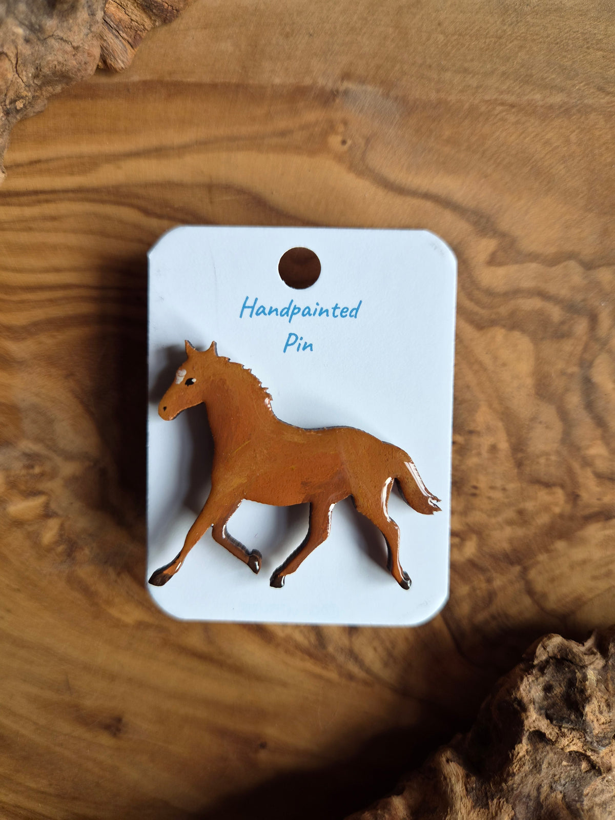 Hand-painted horse shaped wooden pin badge.  chestnut coloured horse with a white star