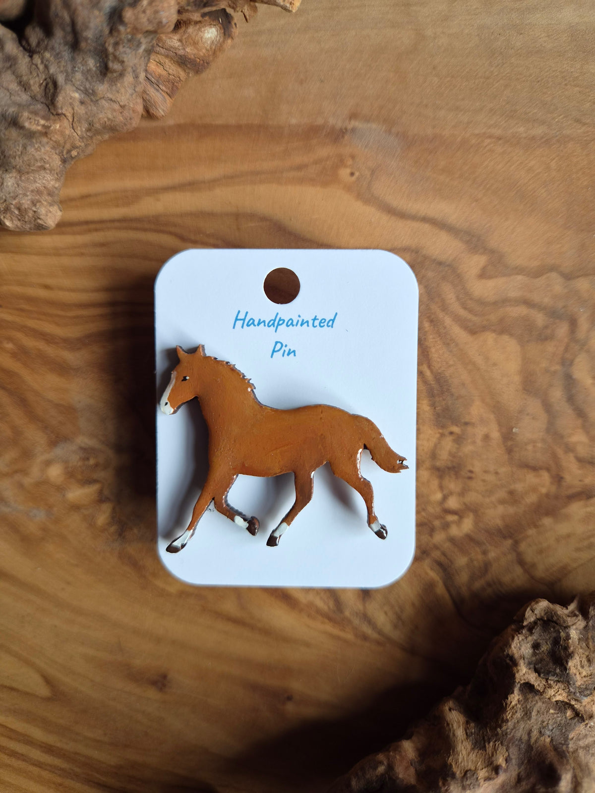 Hand-painted horse shaped wooden pin badge.  Chestnut with blaze and white socks colour