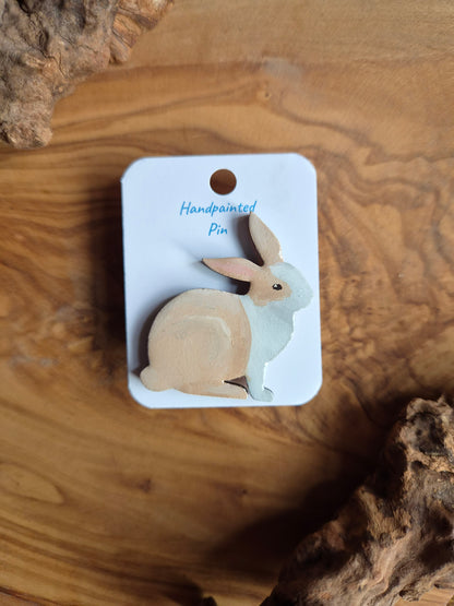Hand-painted rabbit shaped wooden pin badge.  Fawn and white coloured