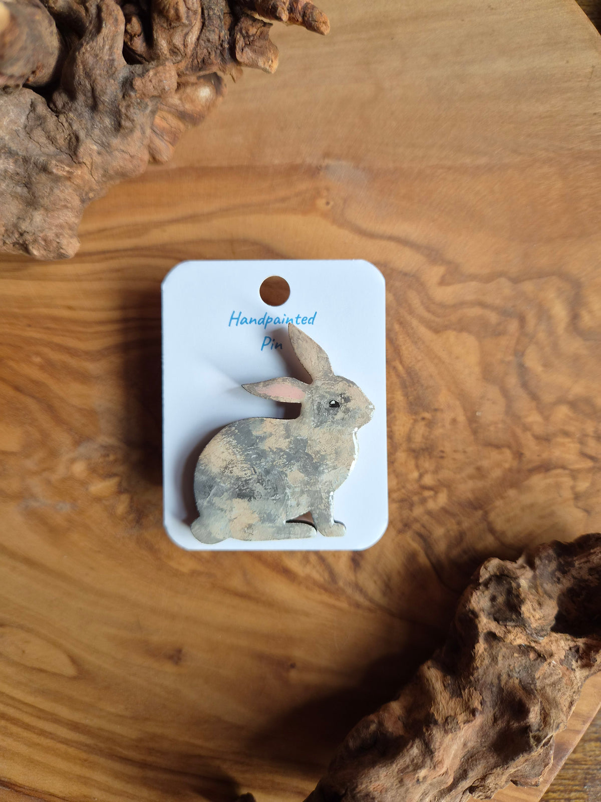 Hand-painted rabbit shaped wooden pin badge.  lilac tortoishell colour
